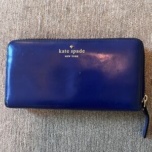 Royal blue Kate Spade wallet with polka dot interior